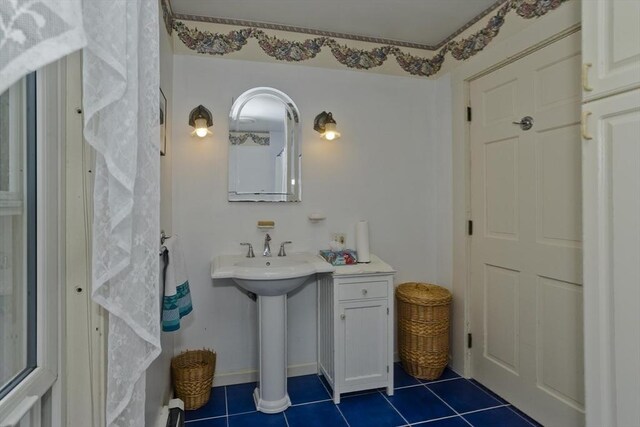 bathroom with tile patterned floors