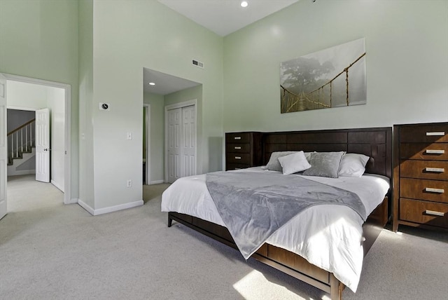 15 Queen Isabella Way Unit 15, Ashland, MA 01721 - bedroom featuring carpet, a closet, baseboards, recessed lighting, and a high ceiling