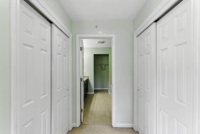 15 Queen Isabella Way Unit 15, Ashland, MA 01721 - hall featuring baseboards and light tile patterned floors