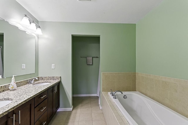15 Queen Isabella Way Unit 15, Ashland, MA 01721 - full bath with tile patterned floors, a garden tub, double vanity, and baseboards