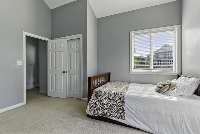 15 Queen Isabella Way Unit 15, Ashland, MA 01721 - carpeted bedroom with a closet, baseboards, and vaulted ceiling