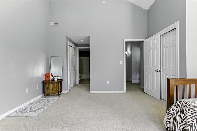 15 Queen Isabella Way Unit 15, Ashland, MA 01721 - carpeted bedroom with a high ceiling, baseboards, and ensuite bath