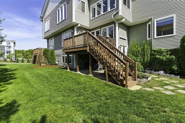 15 Queen Isabella Way Unit 15, Ashland, MA 01721 - back of property with stairs, a wooden deck, and a lawn