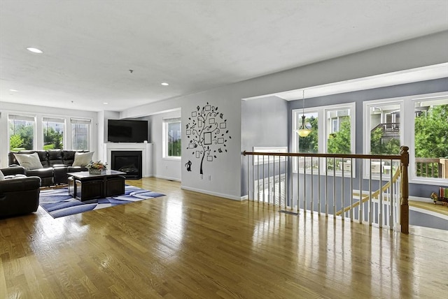 15 Queen Isabella Way Unit 15, Ashland, MA 01721 - living area featuring wood finished floors, baseboards, recessed lighting, and a fireplace