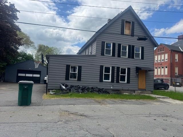 150 Saint Bernard St, Fitchburg, MA 01420 - traditional-style house with a detached garage and an outdoor structure