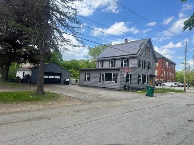 150 Saint Bernard St, Fitchburg, MA 01420 - view of front facade with a garage and an outdoor structure
