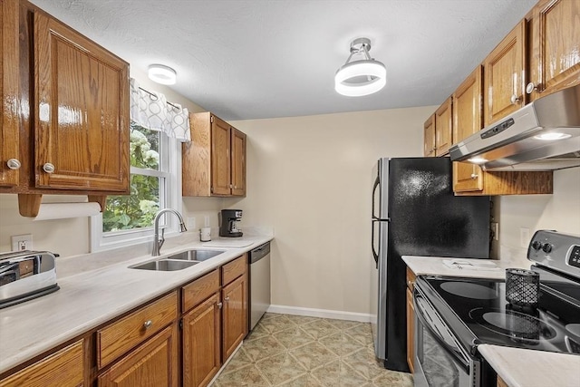 127 Bayberry Hill Ln Unit 127, Leominster, MA 01453 - kitchen featuring appliances with stainless steel finishes, a sink, under cabinet range hood, and brown cabinets
