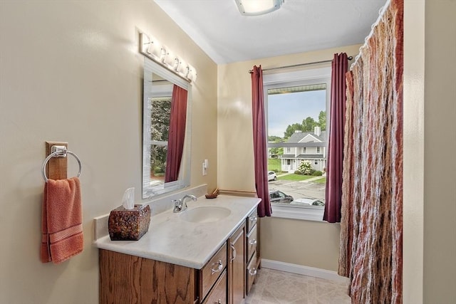 127 Bayberry Hill Ln Unit 127, Leominster, MA 01453 - bathroom featuring vanity, baseboards, and tile patterned floors
