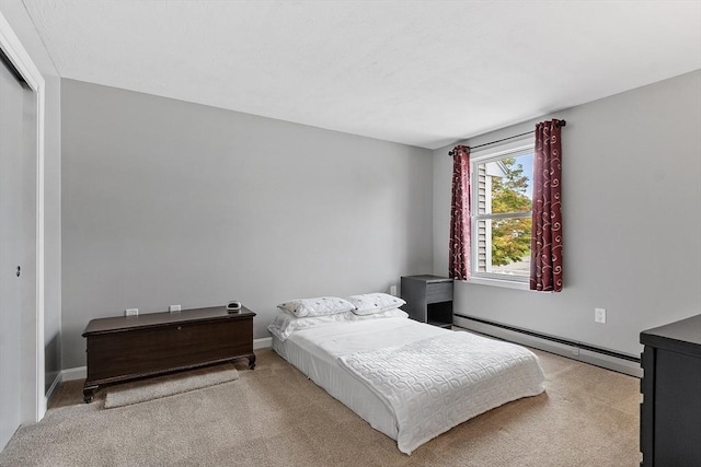 127 Bayberry Hill Ln Unit 127, Leominster, MA 01453 - bedroom featuring a baseboard heating unit, carpet, a closet, and baseboards
