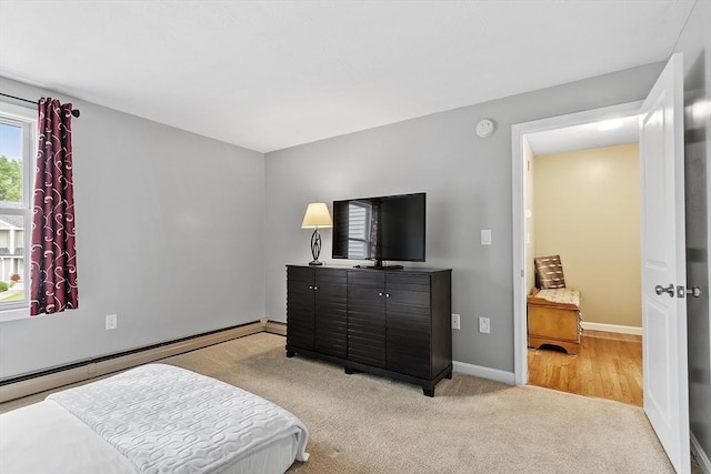 127 Bayberry Hill Ln Unit 127, Leominster, MA 01453 - bedroom with light colored carpet, a baseboard radiator, and baseboards