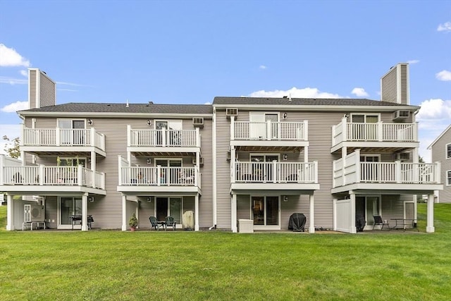127 Bayberry Hill Ln Unit 127, Leominster, MA 01453 - rear view of house with a chimney and a yard