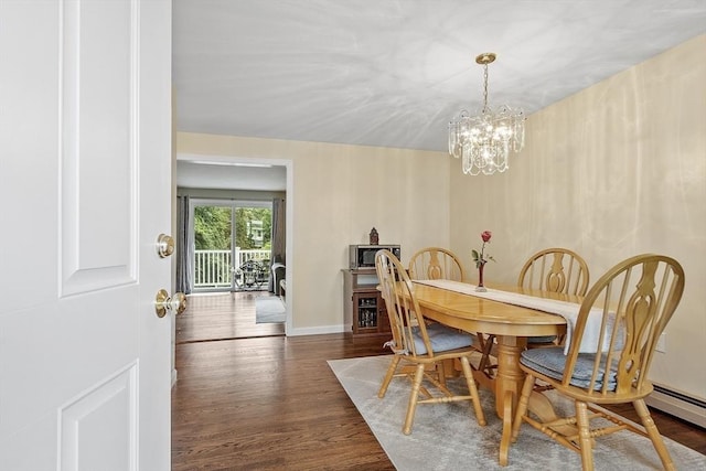 127 Bayberry Hill Ln Unit 127, Leominster, MA 01453 - dining room featuring a chandelier, wood finished floors, baseboards, and baseboard heating