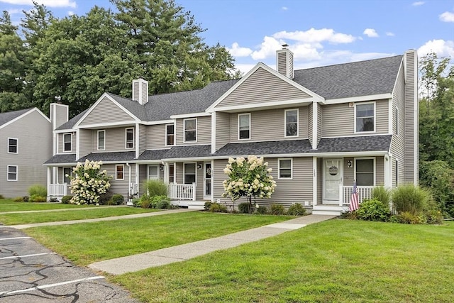 127 Bayberry Hill Ln Unit 127, Leominster, MA 01453 - multi unit property with covered porch, a chimney, a front yard, and roof with shingles