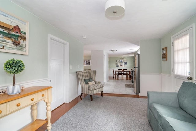 120 Hartford St, Natick, MA 01760 - living area featuring wainscoting and wood finished floors