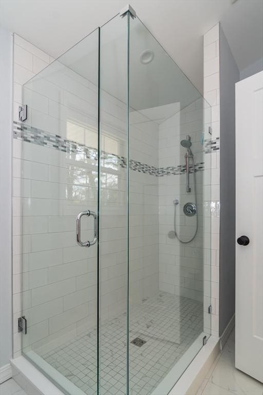 120 Hartford St, Natick, MA 01760 - bathroom with marble finish floors, a shower stall, and baseboards