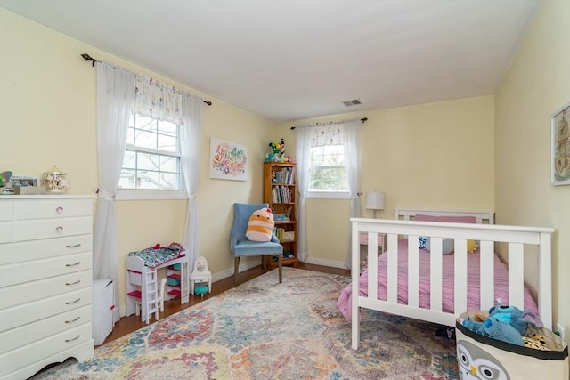 120 Hartford St, Natick, MA 01760 - bedroom featuring baseboards and wood finished floors