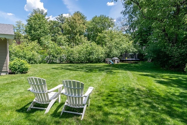 120 Hartford St, Natick, MA 01760 - view of grassy yard featuring a trampoline and a playground