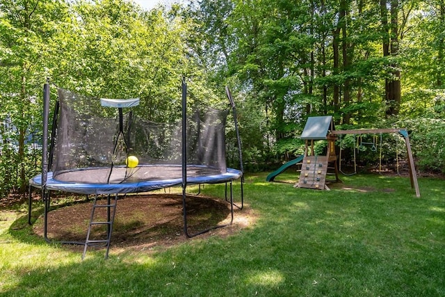 120 Hartford St, Natick, MA 01760 - view of grassy yard featuring a trampoline and a playground