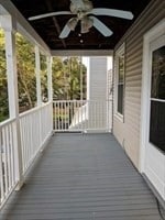 deck with covered porch and ceiling fan