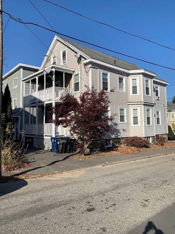 view of front facade featuring a balcony and covered porch