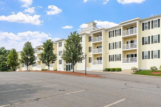 1818 Main St Unit 307, Holden, MA 01522 - view of apartment building / complex featuring uncovered parking