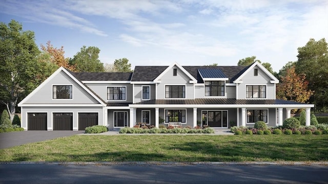 view of front of home featuring a front lawn, a porch, and a garage