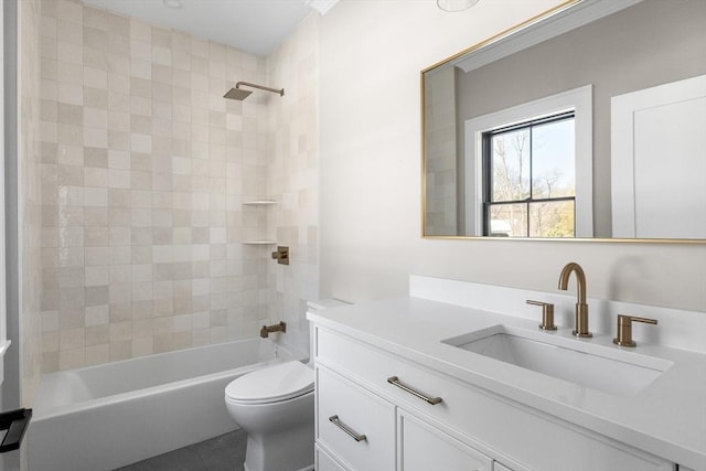 full bathroom with toilet, vanity, and tiled shower / bath