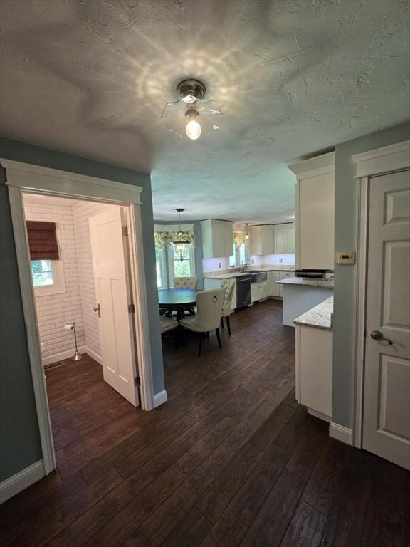 8 Caleb Rd, Shirley, MA 01464 - kitchen featuring dark wood-style flooring, light countertops, dishwasher, white cabinets, and hanging light fixtures