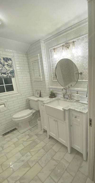 8 Caleb Rd, Shirley, MA 01464 - bathroom with vanity, tile walls, and vaulted ceiling