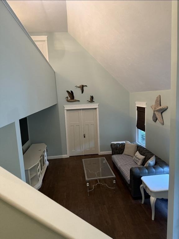 8 Caleb Rd, Shirley, MA 01464 - living area featuring lofted ceiling and wood finished floors