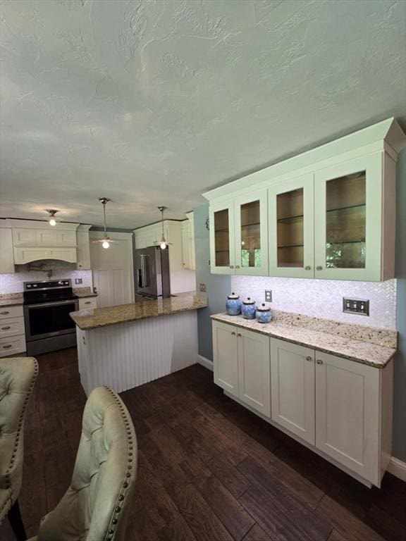 8 Caleb Rd, Shirley, MA 01464 - kitchen featuring stainless steel appliances, a peninsula, dark wood-style flooring, glass insert cabinets, and white cabinetry