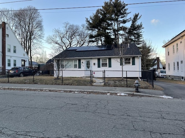 view of front of house featuring solar panels