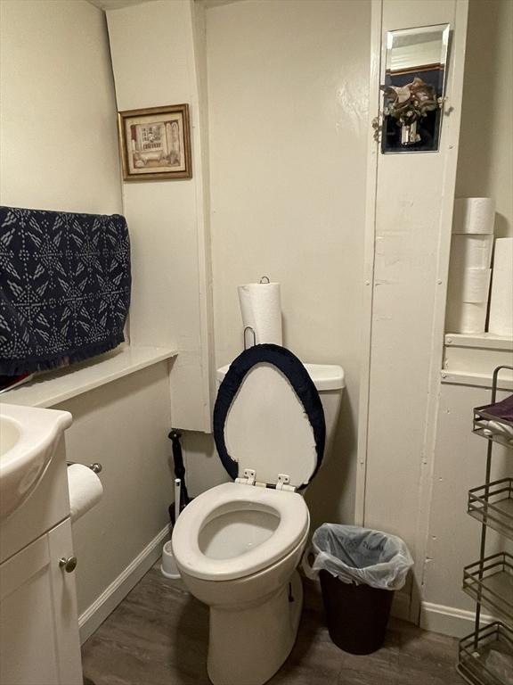 bathroom featuring hardwood / wood-style flooring, vanity, and toilet