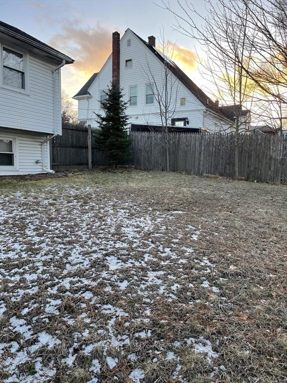 view of yard at dusk