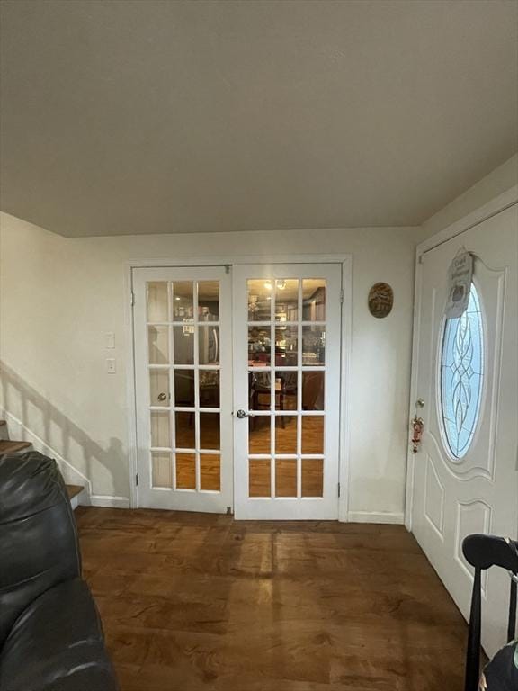 entryway featuring dark hardwood / wood-style floors and french doors