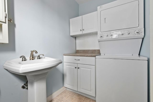 7 Martin St, Danvers, MA 01923 - washroom with estacked washer and dryer and cabinet space