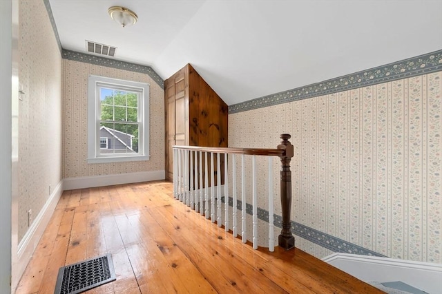 7 Martin St, Danvers, MA 01923 - bonus room featuring wallpapered walls, lofted ceiling, and wood-type flooring