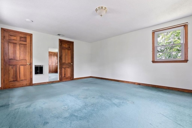7 Martin St, Danvers, MA 01923 - spare room featuring heating unit and carpet