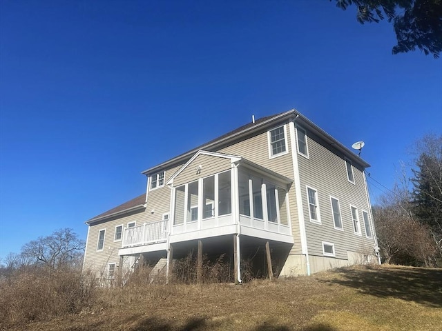 back of house with a sunroom