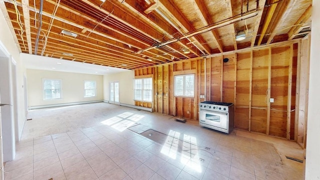 interior space with a baseboard heating unit and visible vents