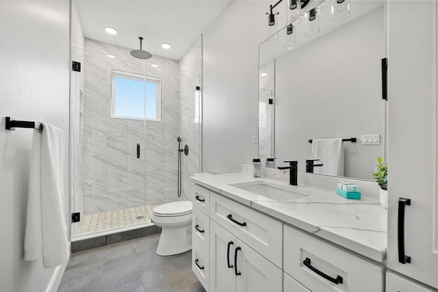 full bath with toilet, a stall shower, recessed lighting, and vanity