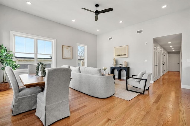 living area with light wood finished floors, ceiling fan, visible vents, and recessed lighting