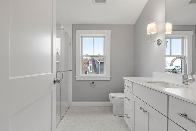 full bath with visible vents, baseboards, vanity, and a shower stall