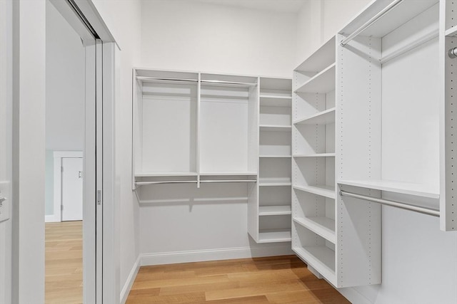 walk in closet featuring light wood-type flooring