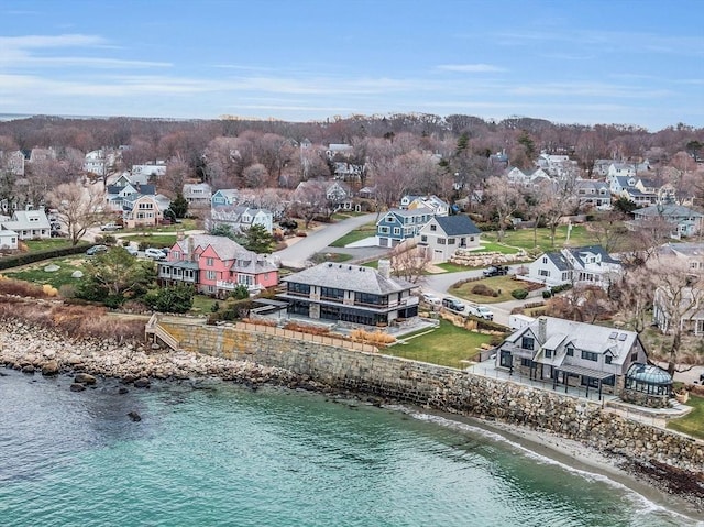 bird's eye view with a residential view and a water view