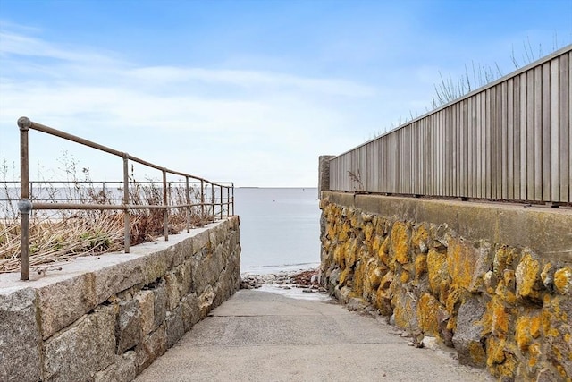 view of community with a water view