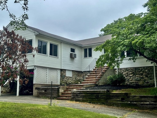 39 Cheever Rd, Malden, MA 02148 - back of property with stairs, cooling unit, and stone siding