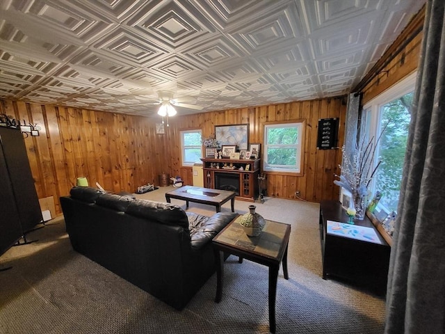 39 Cheever Rd, Malden, MA 02148 - carpeted living area with wooden walls, an ornate ceiling, healthy amount of natural light, ceiling fan, and a fireplace