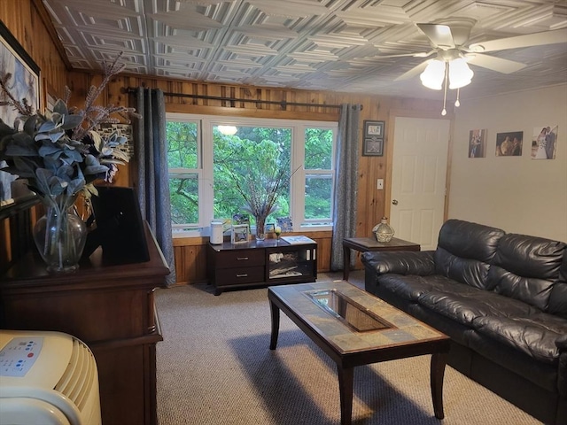 39 Cheever Rd, Malden, MA 02148 - living room featuring wooden walls, light colored carpet, a ceiling fan, and an ornate ceiling