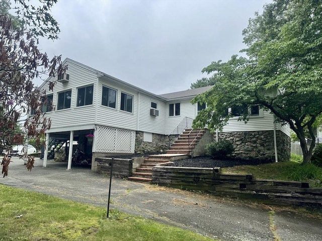 39 Cheever Rd, Malden, MA 02148 - view of front of property featuring stairway, a carport, and driveway
